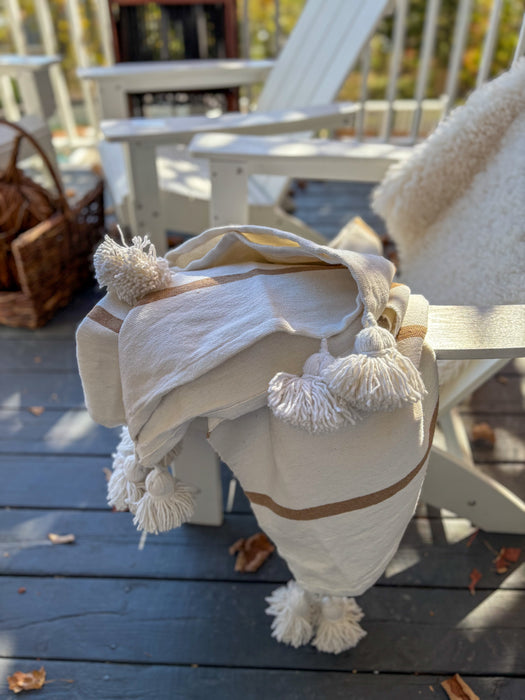 MOROCCO: Handmade Moroccan white pom-pom blanket with camel stripes