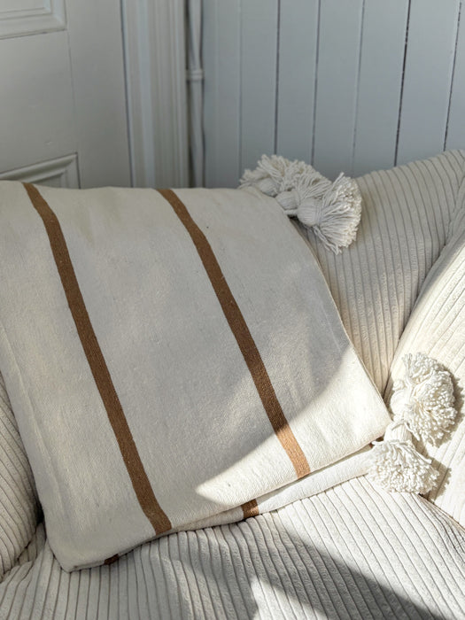 MOROCCO: Handmade Moroccan white pom-pom blanket with camel stripes