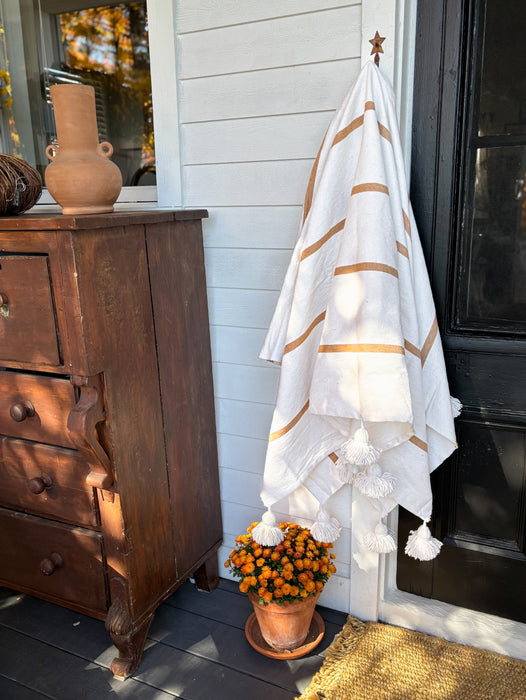 MOROCCO: Handmade Moroccan white pom-pom blanket with camel stripes