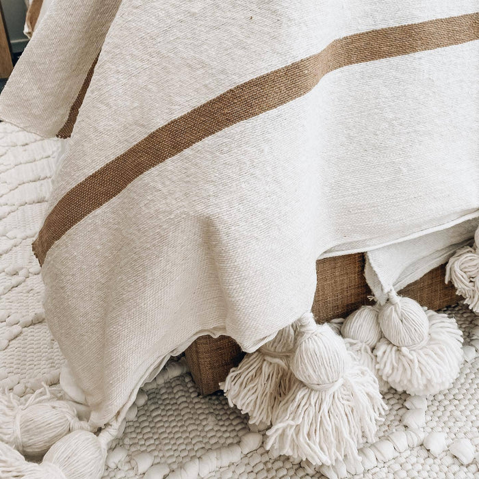 MOROCCO: Handmade Moroccan white pom-pom blanket with camel stripes