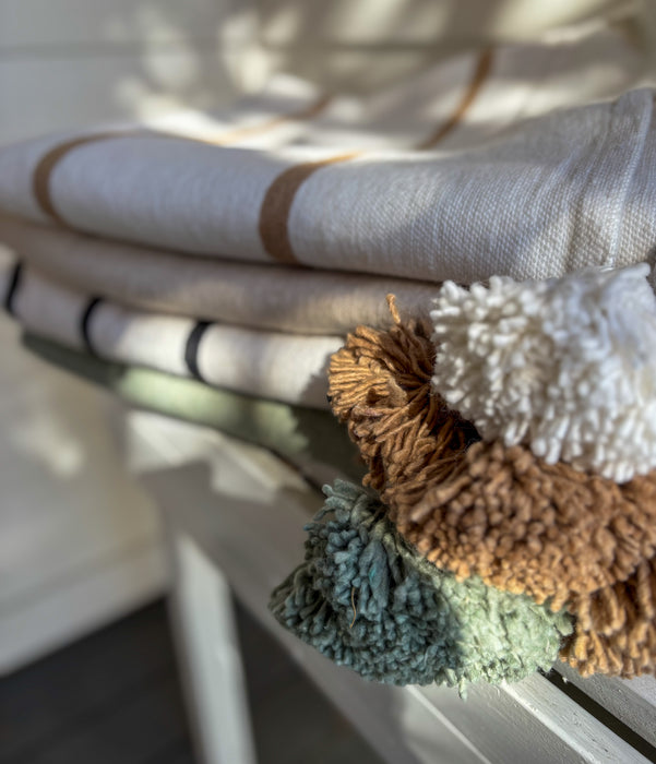 MOROCCO: Handmade Moroccan white pom-pom blanket with camel stripes