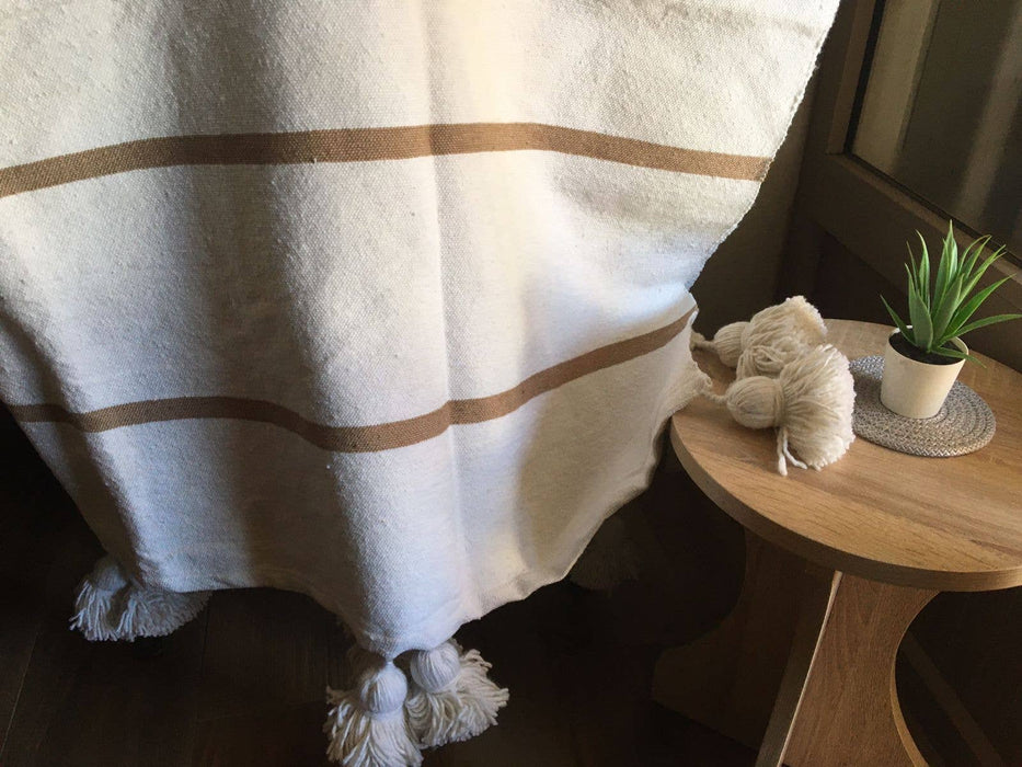 MOROCCO: Handmade Moroccan white pom-pom blanket with camel stripes